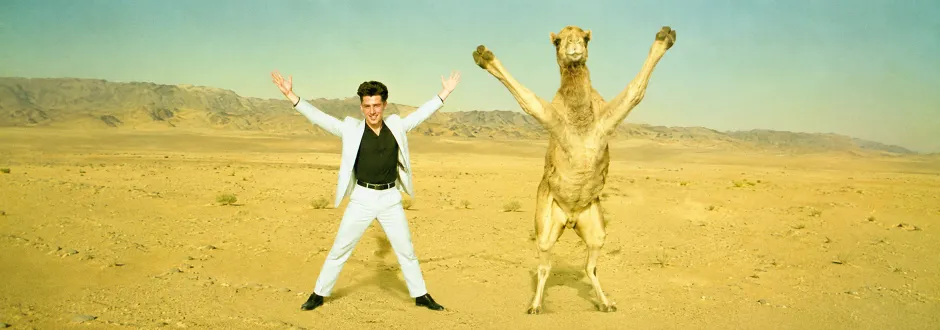 Thomas and a camel in the desert
